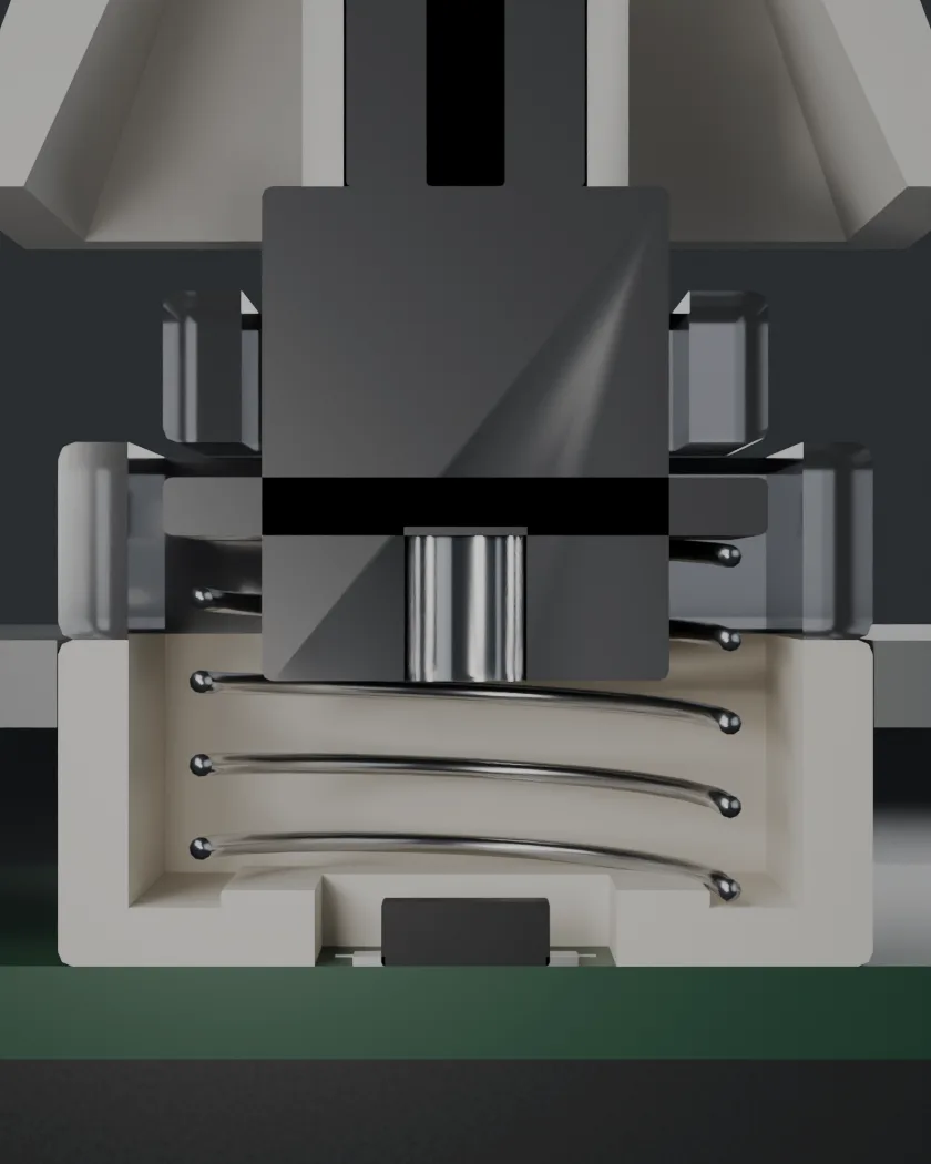 A PALPEUR switch cut in half: the keycap, the stem, the spring, the magnet in the base of the stem, and the sensor on the circuit board below it.